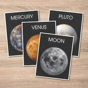 May include: Four educational posters featuring planets and the moon. Each poster has a black background with white text. The posters display Mercury, Venus, Pluto, and the Moon, with detailed illustrations of each celestial body.