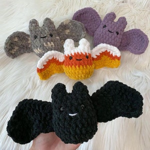 May include: Four crocheted bat plushies in different colours and patterns. The bats are made with soft, fuzzy yarn and have cute, embroidered faces. The bats are a great addition to any Halloween decor.