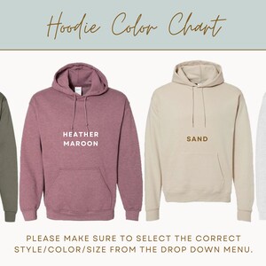 May include: Colour chart for hoodies in four colours: military green, heather maroon, sand, and ash. The text "Hoodie Color Chart" is at the top of the image. The text "PLEASE MAKE SURE TO SELECT THE CORRECT STYLE/COLOUR/SIZE FROM THE DROP DOWN MENU." is at the bottom of the image.