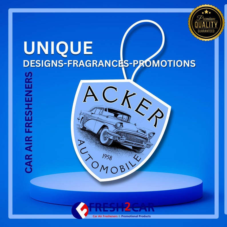 May include: A blue car air freshener with a classic car design, the word "ACKER" and "AUTOMOBILE 1958" printed on it. The image also includes the text "UNIQUE DESIGNS-FRAGRANCES-PROMOTIONS" and "CAR AIR FRESHENERS".