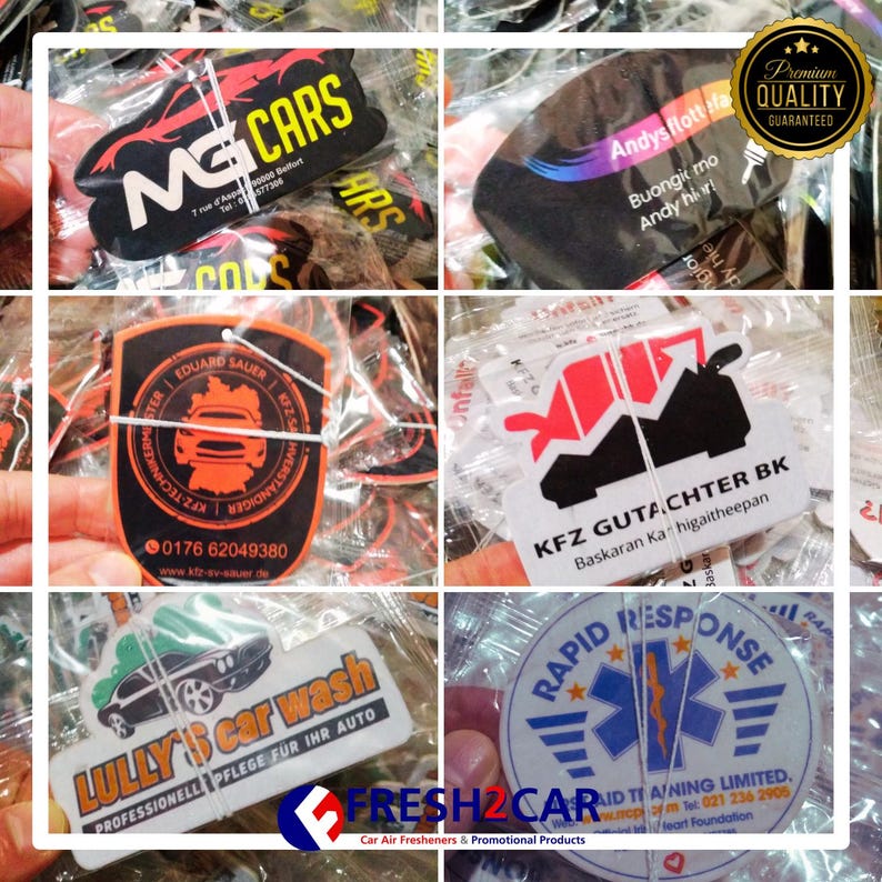 May include: Assorted car air fresheners with various designs and text. Includes a black and red car-shaped freshener with "MG CARS" and a black freshener with "Andys flott Ha". Other designs include "EDUARD SAUER", "KFZ GUTACHTER BK", "LULLY'S car wash", and "RAPID RESPONSE".
