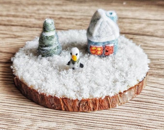 Christmas diorama. Miniature small world Christmas tree and snowman scene decoration