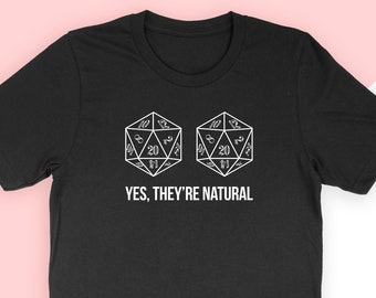 May include: Black t-shirt with a white graphic of two twenty-sided dice and the text "YES, THEY'RE NATURAL".
