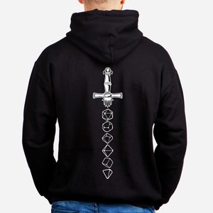 May include: Black hooded sweatshirt with a white design of a sword and dice on the back.
