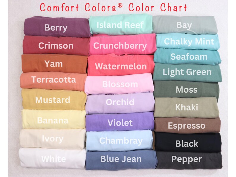 May include: A color chart of Comfort Colors&reg; t-shirt fabric swatches. The chart includes 18 different colors, including berry, crimson, yam, terracotta, mustard, banana, ivory, white, island reef, crunchberry, watermelon, blossom, orchid, violet, chambray, blue jean, bay, chalky mint, seafoam, light green, moss, khaki, espresso, black, and pepper.