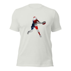 May include: White t-shirt with a silhouette of a tennis player in the shape of the American flag.