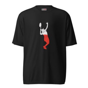 May include: Black t-shirt with a white silhouette of a person playing tennis. The person is wearing a red and white outfit, resembling the Polish flag.