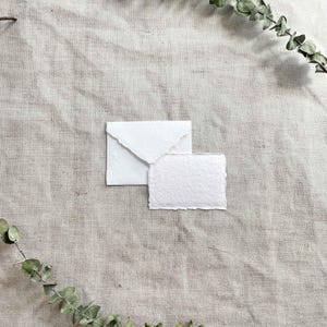 Small White Recycled cotton rag paper and envelopes with deckled edges.