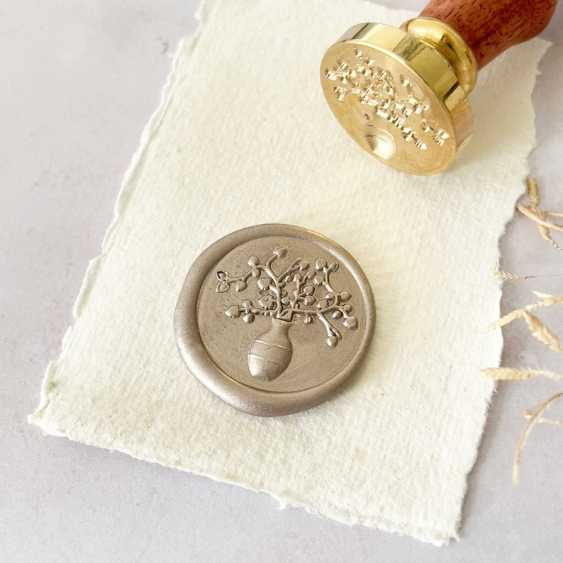 sealing wax stamp with vase and flowers.  Floral wax seal