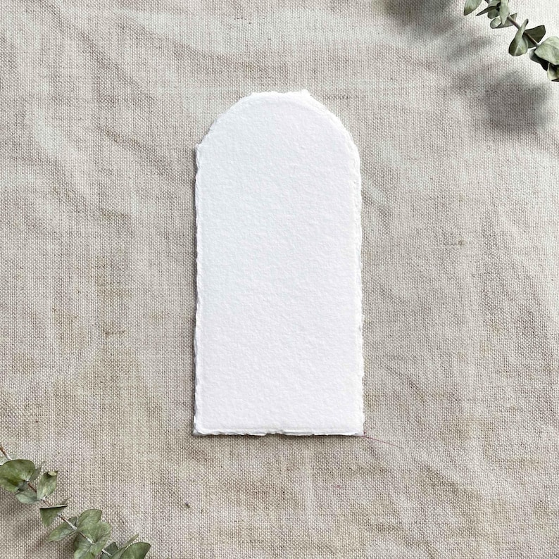 Arch shaped card made from white recycled cotton rag paper with deckled edges