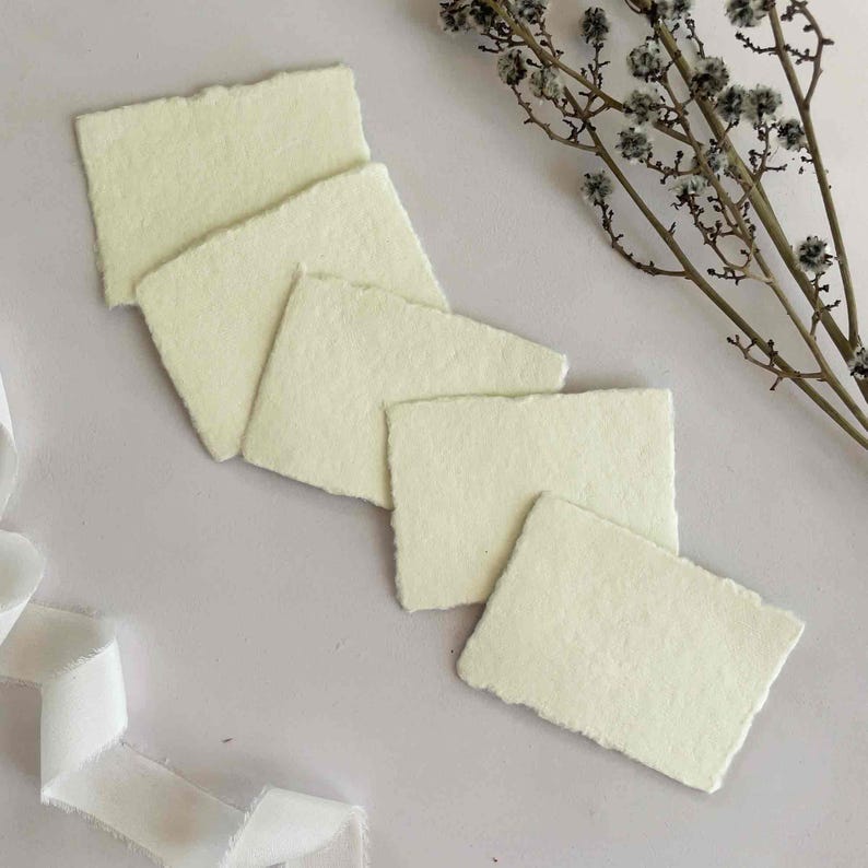 Handmade cotton rag paper.  Small panels of deckle edge paper in cream.  By The Natural Paper Company