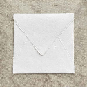 Square handmade paper envelope with deckled edges