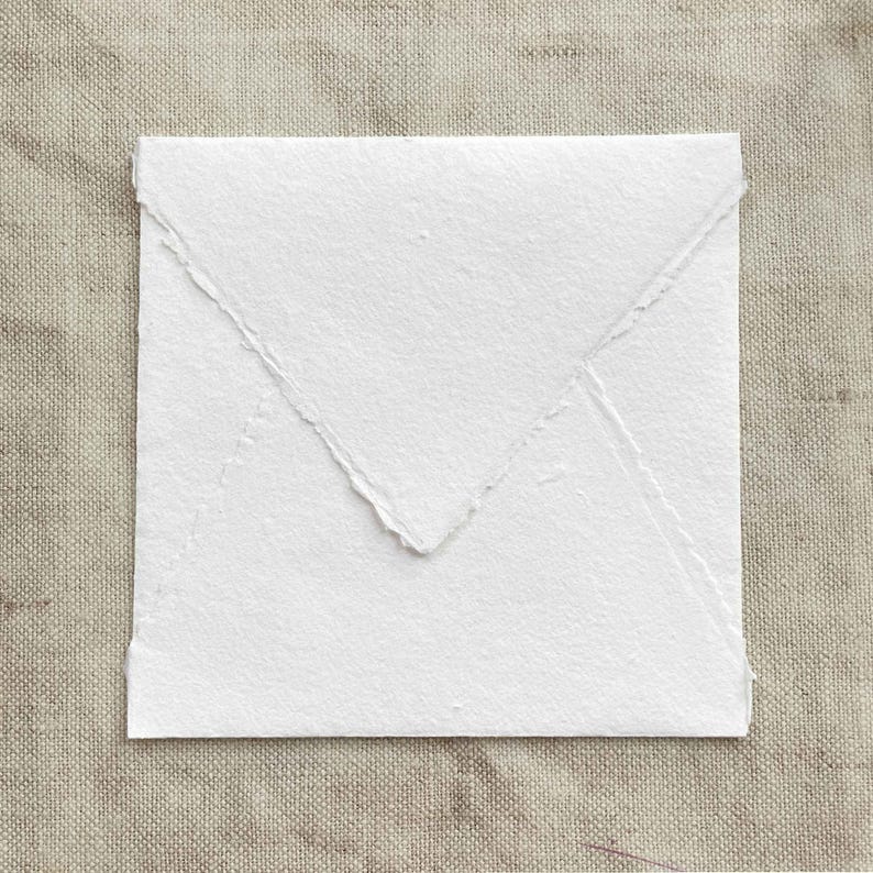 Square handmade paper envelope with deckled edges