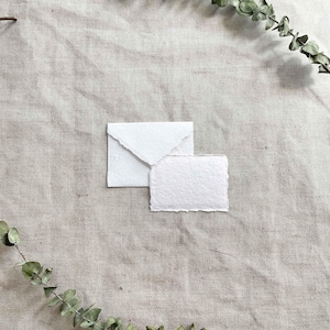 Small White Recycled cotton rag paper and envelopes with deckled edges.