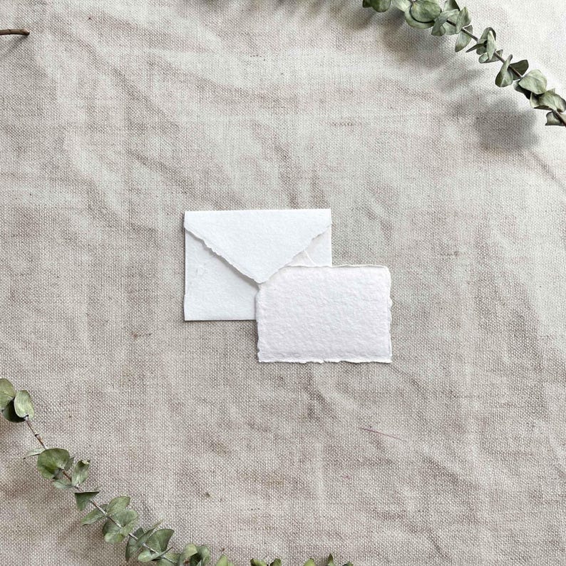 Small White Recycled cotton rag paper and envelopes with deckled edges.