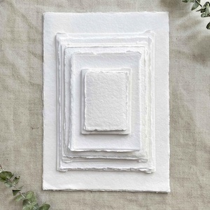 White handmade cotton rag paper and card with deckled edges in various sizes