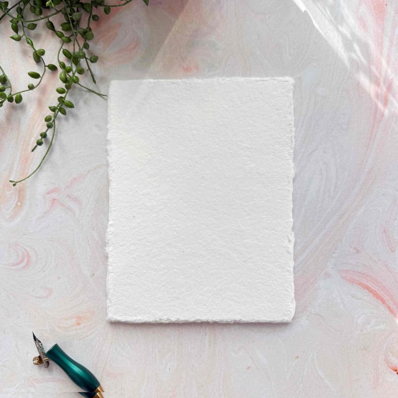 textured watercolour paper with deckled edges