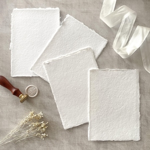 Bright white handmade recycled paper with a deckle edge.  Luxury handmade paper suitable for watercolour painting and calligraphy.  By The Natural Paper Company