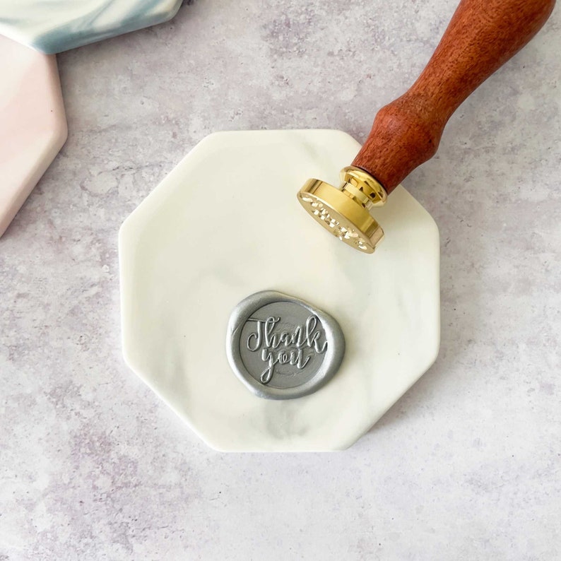 ceramic wax stamping pad in grey and white marble finish.  Make wax seals easily and cleanly