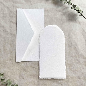 White handmade paper and envelope with a deckled edge.  Arch shaped card made from recycled cotton rag