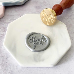 wax stamping mat for making wax seals.  Easy to use stamping pad in grey and white marble finish