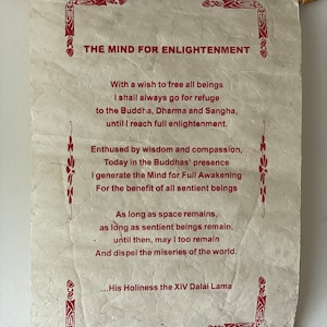 May include: A scroll with red text on a white background. The text reads "The Mind for Enlightenment" and includes a quote from the Dalai Lama. The scroll is rolled up and tied with a string.