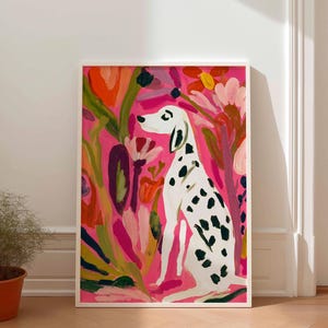 May include: A framed art print featuring a white Dalmatian dog with black spots sitting in a garden of abstract flowers. The background is a vibrant hot pink, with painted floral elements in shades of orange, red, and green surrounding the dog.