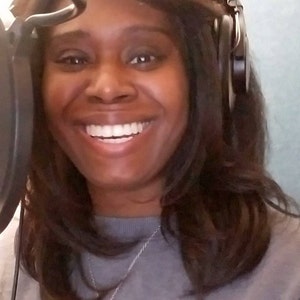 Picture of the seller: A smiling person with dark hair wearing a gray sweater and a silver necklace with a pendant. The person is wearing headphones and is positioned in front of a microphone. Audio Astrology Chart Reading Personalized Audiobook Gift, Astrology Reading, Birth Chart Print, Natal Chart Reading, Zodiac Spiritual Gifts. natal chart reading, astrology chart reading, birth chart print