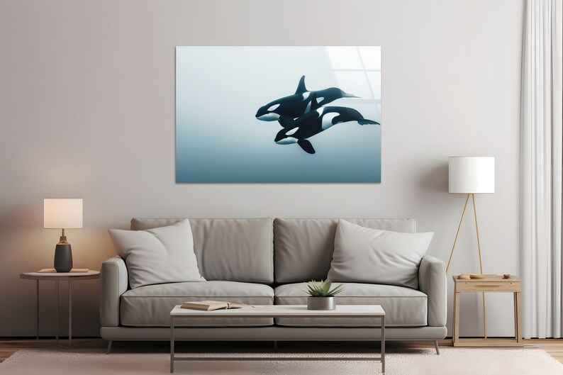 Puede incluir: Una impresi&oacute;n de arte digital con tres orcas nadando en un fondo degradado azul y blanco. Las orcas son negras y blancas con una forma elegante y aerodin&aacute;mica.