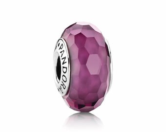 May include: A purple faceted glass bead charm with the word "PANDORA" engraved on the side.