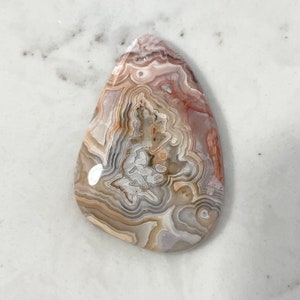 Crazy Lace Agate cabochon.