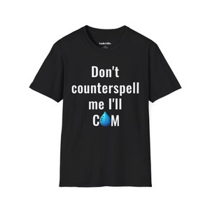 May include: Black t-shirt with white text that reads "Don't counterspell me I'll COM" with a blue water drop icon.