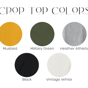 May include: Five color swatches for a crop top. The colors are mustard yellow, military green, heather athletic gray, black, and vintage white.