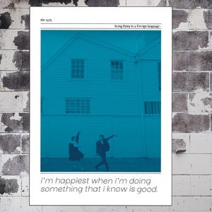 May include: A black and white photograph of two people standing in front of a house. The photo is tinted blue. The text "the 1975" and "being funny is a foreign language" is at the top of the photo. The text "i'm happiest when i'm doing something that i know is good." is at the bottom of the photo.