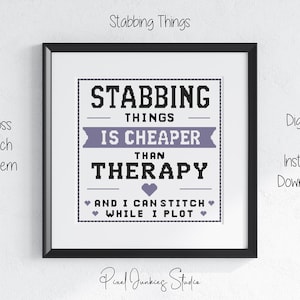 May include: A framed cross stitch pattern featuring the black and purple text: STABBING THINGS IS CHEAPER THAN THERAPY AND I CAN STITCH WHILE I PLOT. The design includes a purple banner, a purple heart, and small purple hearts surrounding the text.