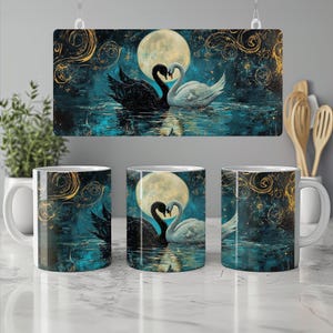 May include: A set of three white ceramic mugs and a decorative sign featuring a romantic scene. The artwork depicts a black and white swan couple in front of a full moon, set against a teal and gold background. The mugs have a similar design.