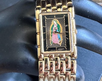 Rzadki, zabytkowy, pozłacany zegarek Citizens Lady Guadalupe, emaliowana figurka, rozmiar 6,75, doskonały stan, sprawny