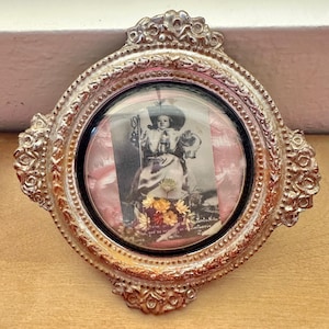 Santo Nino Atocha The Holy Child Catholic Round Domed Glass Framed Religious Decor, Ornate Silver Plastic Frame with Child and Dried Flowers