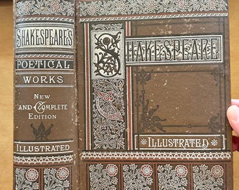 May include: A vintage edition of Shakespeare's "Poetical Works" with an illustrated cover. The book is bound in brown with ornate floral and scroll designs in white, red, and black. The spine reads "Shakespeare's Poetical Works" and "Illustrated".
