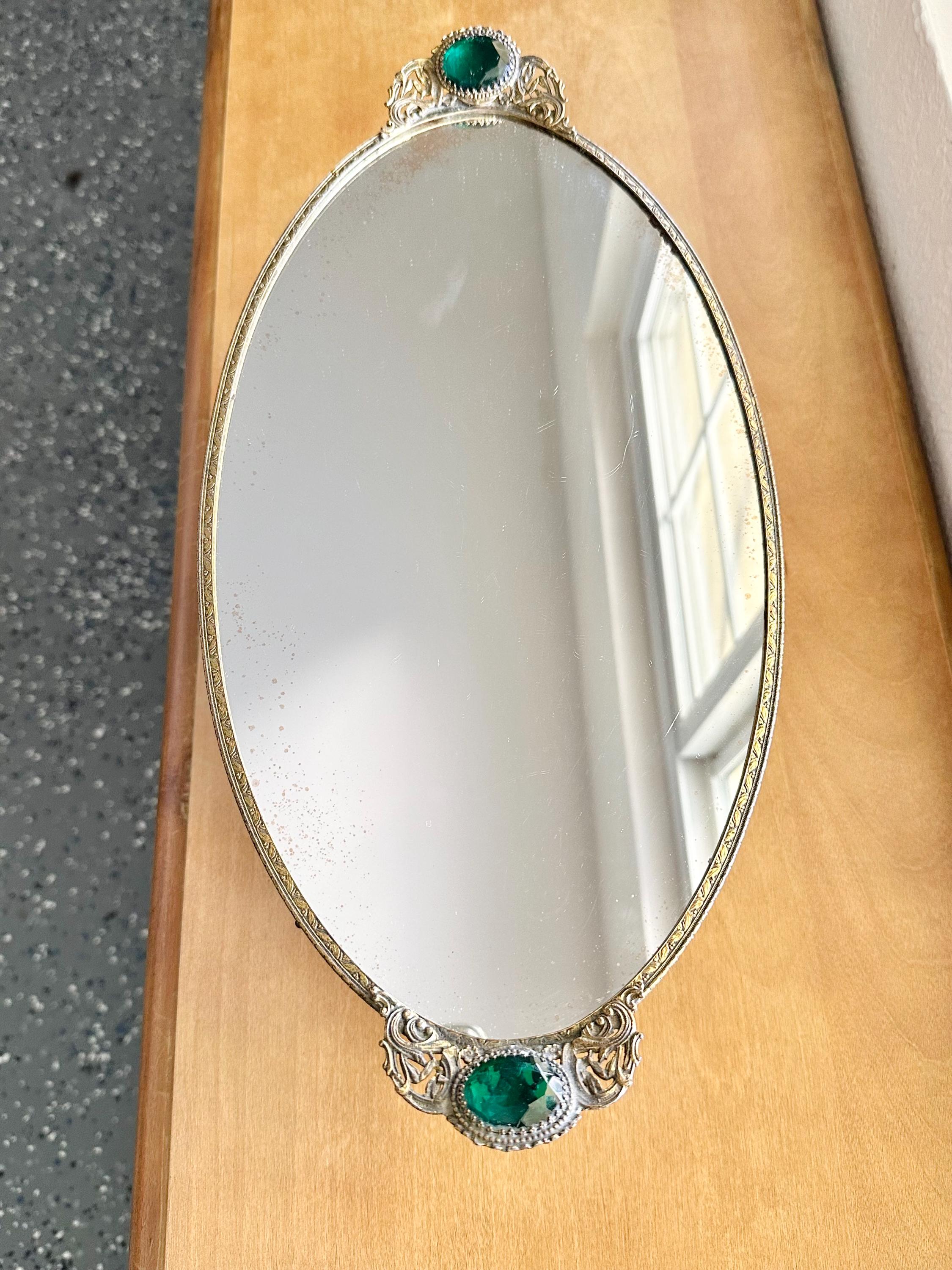 Hollywood Regency Gold Tone Oval Vanity Dresser Tray Mirror Green Glass Faceted Jewels Faux Emerald and Gold Filigree, Vintage 1950s