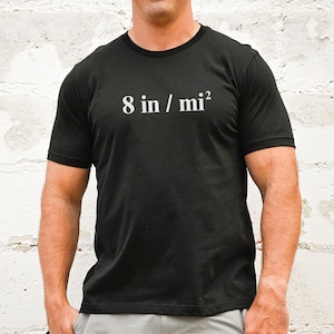 May include: A black t-shirt with white text that reads "8 in / mi²".