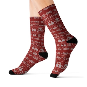 May include: Red socks with a repeating pattern of white snowflakes, locks, skulls, and the text "SECURITYCYBERS". The socks have black heels and toes. The design resembles a holiday sweater.