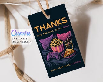 May include: A black gift tag with the word "THANKS" in orange, and the text "FOR THE EPIC NIGHT, GIRL!" in white. The tag features illustrations of popcorn, pizza, a drink, and a game controller. The tag is attached to a brown string.