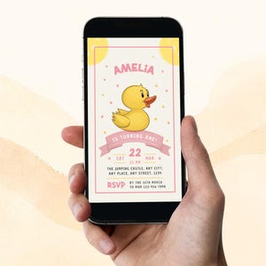 May include: A pink and yellow digital invitation for a first birthday party. The invitation features a cartoon yellow rubber duck and the text "Amelia is turning one!" with the date and time of the party.