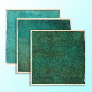 May include: Three framed squares of green watercolour paper, each with a different shade of green. The squares are arranged in a descending order of size, with the largest square at the top and the smallest square at the bottom.