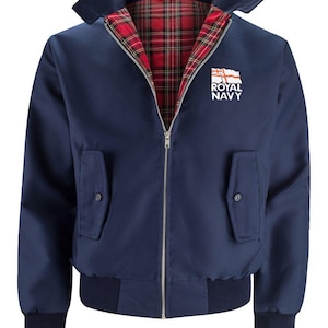 May include: A navy blue bomber jacket with a red and black tartan lining. The jacket has a zip fastening and a patch on the left chest that says "Royal Navy" with a white flag.