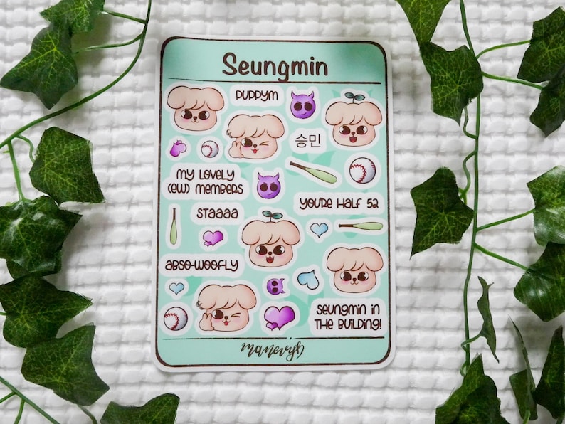 May include: A rectangular sticker sheet with a light green background featuring cartoon puppy illustrations, baseballs, bats, and hearts. Text includes Seungmin, Puppym, My Lovely (ew) Members, Staaaa, Abso-woofly, You're Half 52, and Seungmin In The Building.