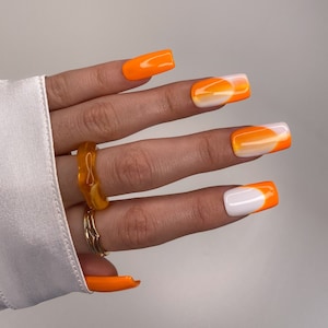 Orange Nail Designs - OMBRE NAILS WITH RHINESTONES Next, we have a chic  ombre nail design to show you. Three of the visible nails feature an ombre  design and there are two