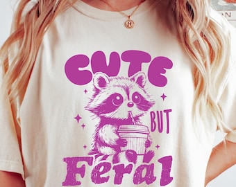 Cute But Feral T-Shirt, Meme Funny Raccoon Tee, Oversized Graphic Shirt, Women's shirts, Gift for Her, Fall Coffee Shirt, Raccoon Meme Tee