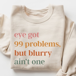 Eye Got 99 Problems But Blurry Ain't One Sweatshirt, Optometry Hoodie, Optometry Gifts, Glasses Sweater, Optometrist Gift, Optical Gift